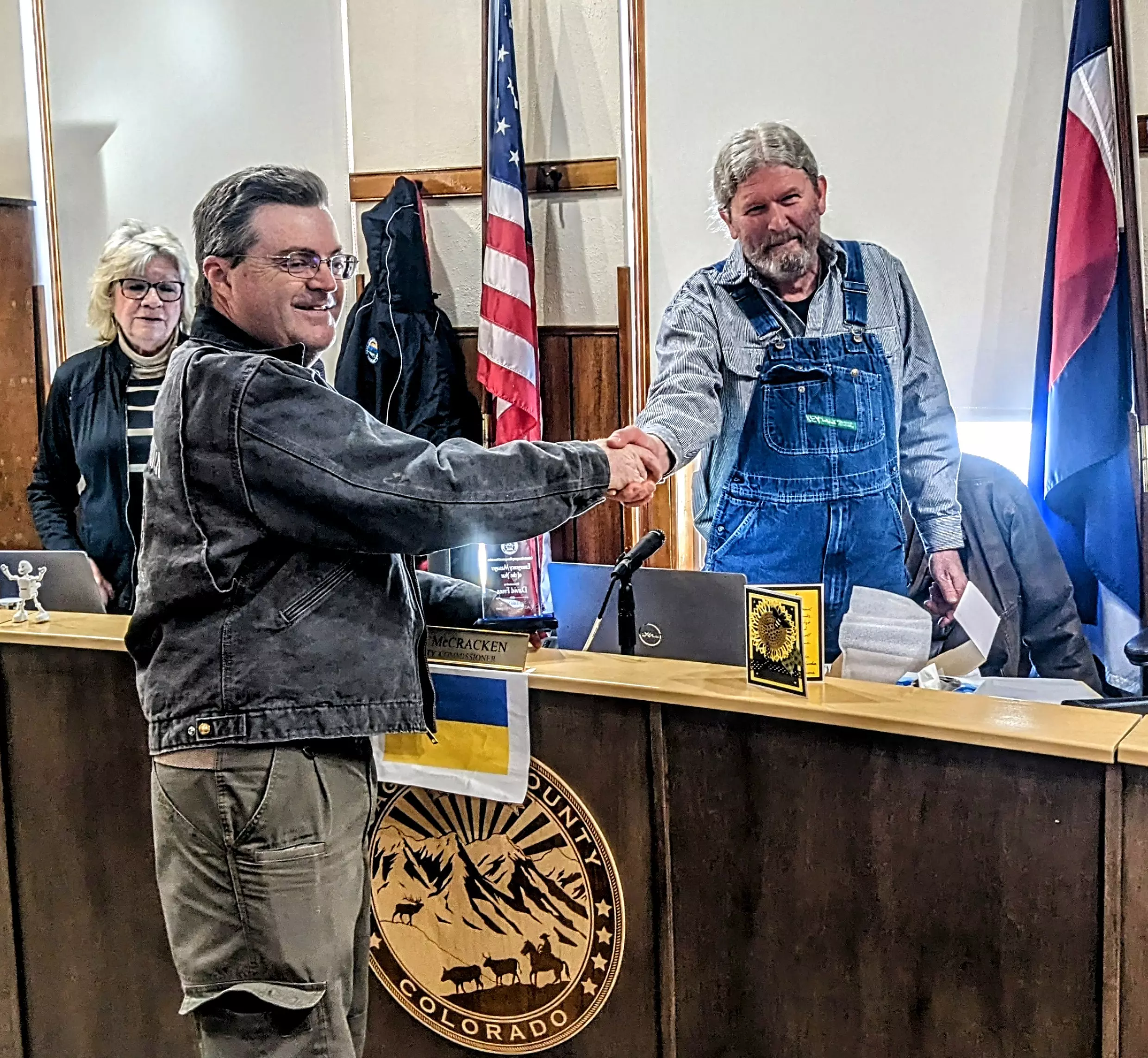 Photo of David Frees (left) accepting the “Emergency Manager of the Year Award” from Saguache County Board Chair, Tom McCracken, presented on behalf of the Colorado Emergency Management Association, in the Saguache County Commissioners room on Feb. 21, 2023.